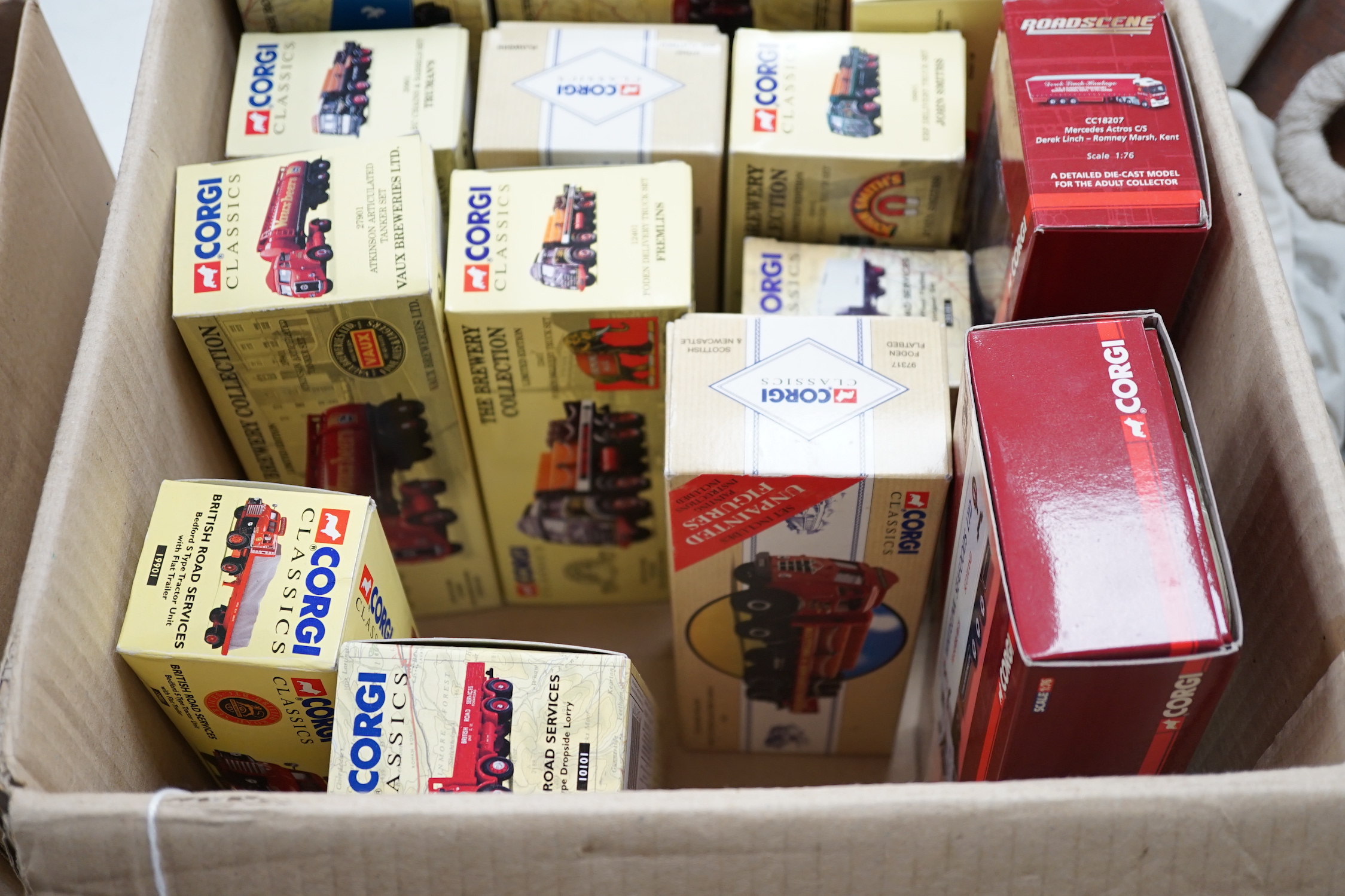 Eighteen boxed Corgi and Corgi Classics diecast commercial vehicles including tanker wagons, flatbed lorries, articulated box trailers, etc.